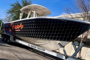 Sailfish 290 CC 2016 Sailfish 290 CC boat on trailer with custom black and orange design.