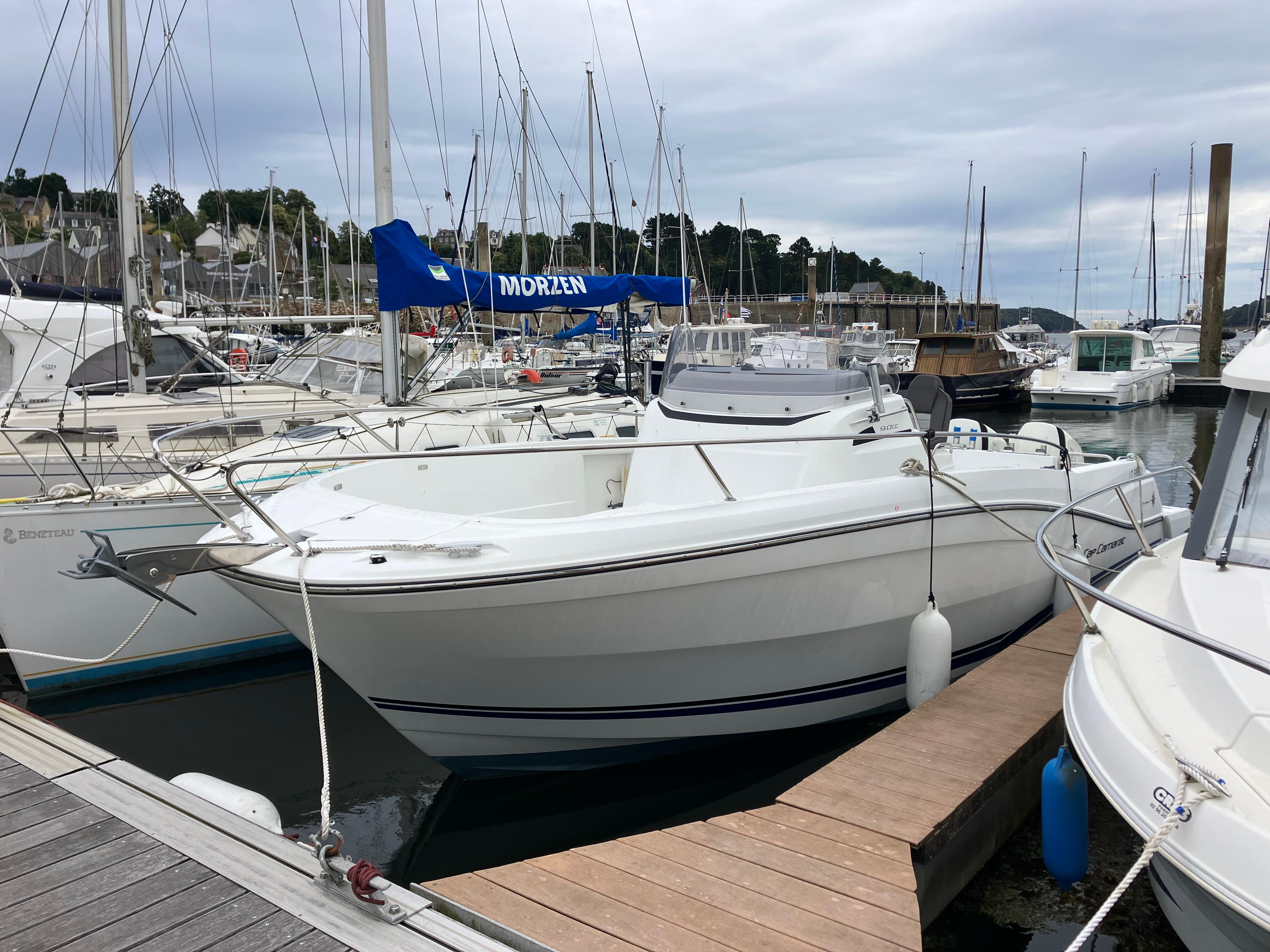 Jeanneau Cap Camarat 9.0 CC 2019 Jeanneau Cap Camarat 9.0 CC boat docked in a marina with other vessels.