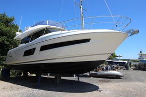 Prestige 460 2019 Prestige 460 yacht on dry dock under clear blue sky.