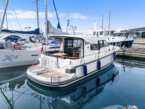 Nimbus 365 Coupe 2018 Nimbus 365 Coupe docked at marina, surrounded by other boats.