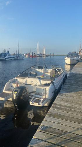 Jeanneau Cap Camarat 6.5 DC 2019 Jeanneau Cap Camarat 6.5 DC docked at a marina under clear blue skies.