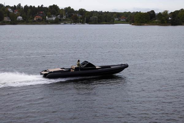 Goldfish 38 Supersport 2018 Goldfish 38 Supersport boat cruising on a calm lake.