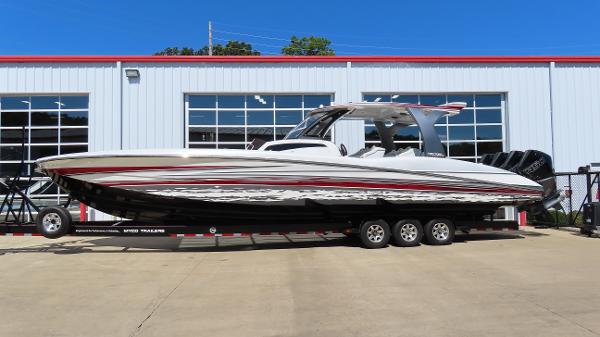 MTI V42 2017 MTI V42 boat on trailer outside a warehouse.