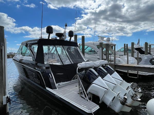 Formula 380 Super Sport Crossover OB 2022 Formula 380 Super Sport Crossover OB docked under a partly cloudy sky.