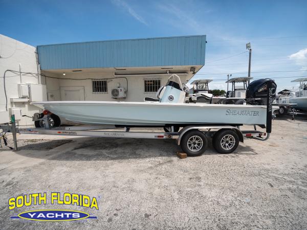 ShearWater x22 2023 ShearWater X22 boat on trailer at South Florida Yachts dealership.