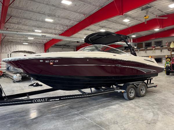 Sea Ray 250 SLX 2011 Sea Ray 250 SLX boat on trailer in indoor storage facility.