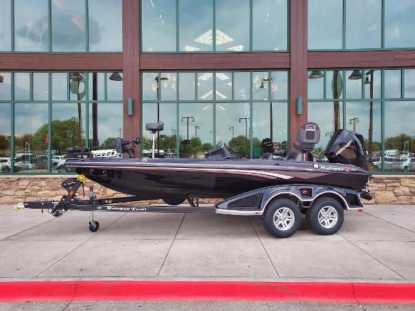 Ranger Z518 2025 Ranger Z518 boat on trailer, parked outside a building with large windows.
