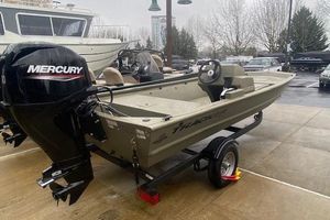 Tracker Grizzly 1648 SC 2026 Tracker Grizzly 1648 SC boat with Mercury engine on trailer, parked outdoors.