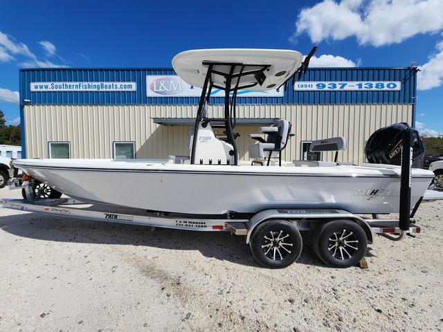 Pathfinder 2300 HPS 2025 Pathfinder 2300 HPS boat on trailer, parked outside Southern Fishing Boats dealership.