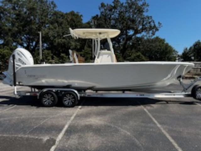 Pathfinder 2700 Open 2025 Pathfinder 2700 Open boat on trailer, parked outdoors.