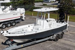 BlackJack 256 Bay 2021 BlackJack 256 Bay boat on trailer, parked outdoors in a marina setting.