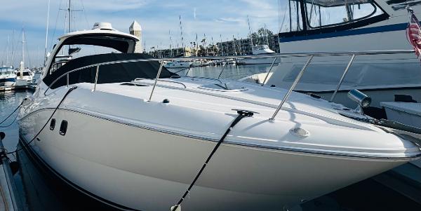 Sea Ray 310 Sundancer 2007 Sea Ray 310 Sundancer yacht docked at marina, sleek white design.