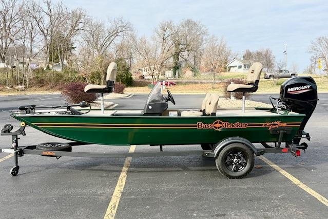 Tracker Bass Tracker Classic Limited 2026 Tracker Bass Tracker Classic Limited boat on trailer in parking lot.