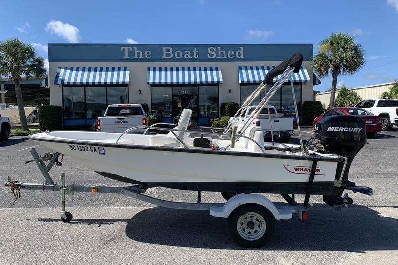 Boston Whaler 130 Sport 2007 Boston Whaler 130 Sport boat on trailer outside The Boat Shed dealership.