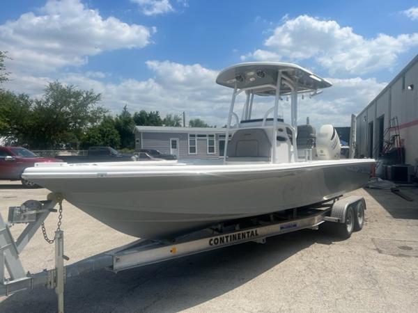 Sea Pro 248 2021 Sea Pro 248 boat on a Continental trailer in a sunny outdoor setting.