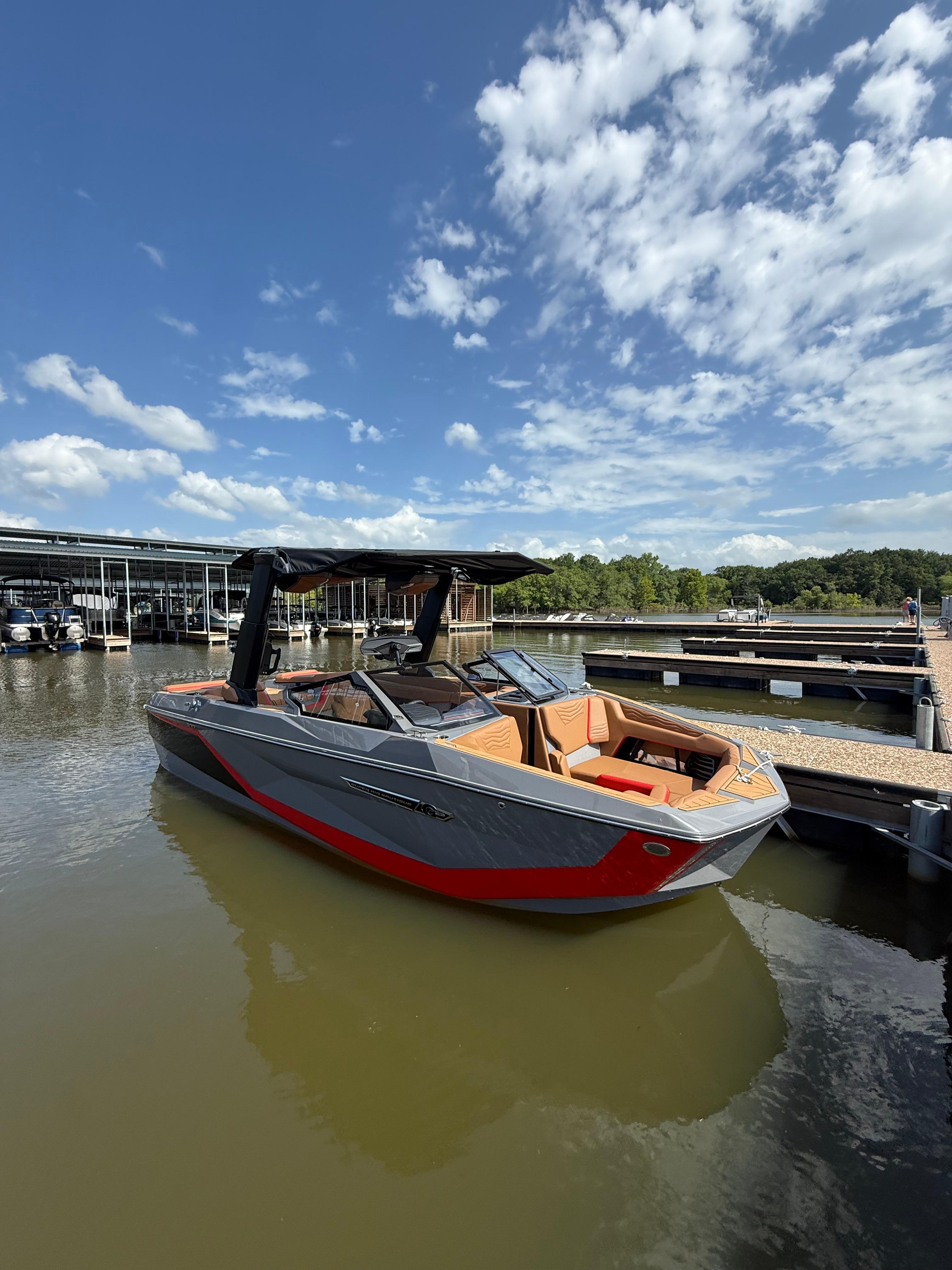Nautique Super Air Nautique G23 2025 Nautique Super Air Nautique G23 boat docked on a sunny day.