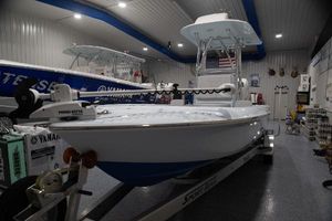 Contender 26 Bay 2024 Contender 26 Bay boat in showroom, featuring Minn Kota trolling motor.