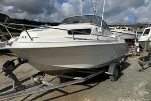 Drago Fiesta 550 Drago Fiesta 550 boat from 2005 on a trailer, parked outdoors under cloudy skies.