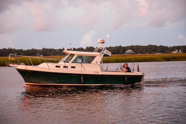 Albin 28 Tournament Express 2002 Albin 28 Tournament Express boat cruising on calm water at sunset.