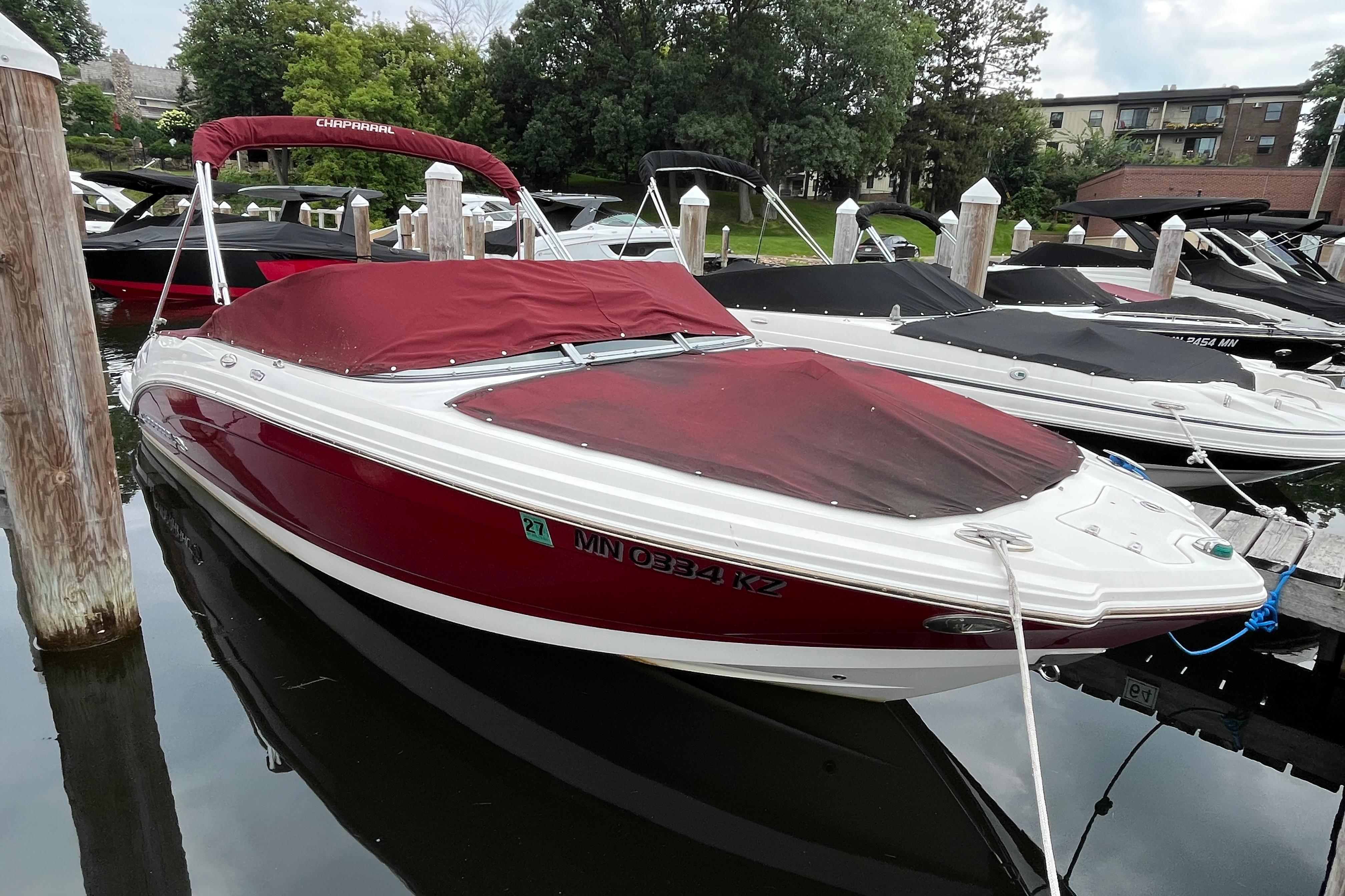 Chaparral 226 SSi Wide Tech 2013 Chaparral 226 SSi Wide Tech boat docked with red cover.