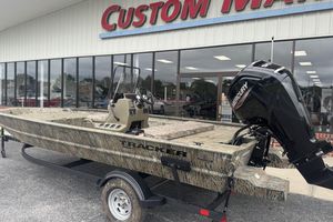 Tracker Grizzly 1860 CC 2026 Tracker Grizzly 1860 CC boat with Mercury engine outside dealership.