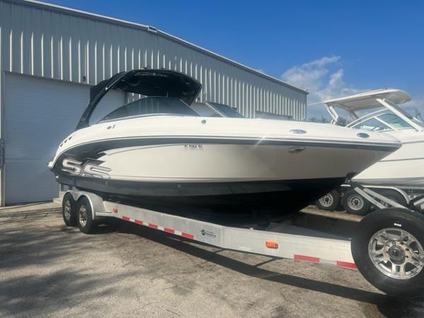 Chaparral 276 Ssx 2009 Chaparral 276 SSX boat on a trailer outside a storage facility.
