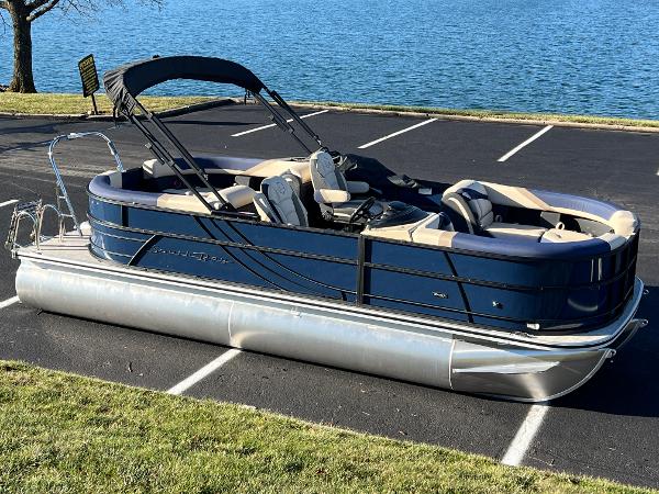 South Bay 222RS 2025 South Bay 222RS pontoon boat parked near a lake.