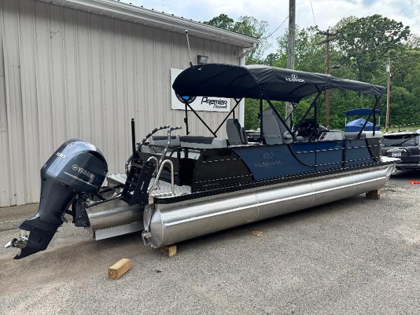 Veranda Relax VR25VLC 2025 Veranda Relax VR25VLC pontoon boat with Yamaha outboard motor, parked outdoors.