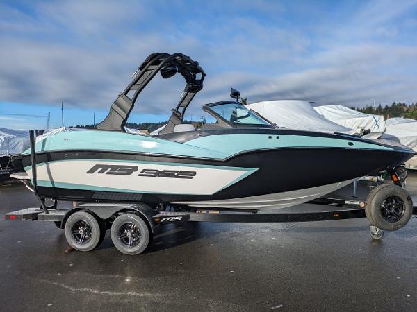 MB B52-21 Alpha 2025 MB B52-21 Alpha boat on trailer, sleek design, parked outdoors.