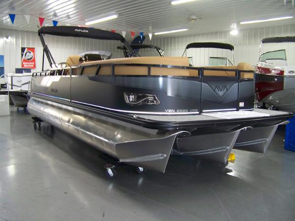 Avalon Venture 85 Versatile rear Bench 2025 Avalon Venture 85 Versatile Rear Bench pontoon boat in showroom, sleek design, modern features.