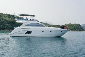 Beneteau Monte Carlo 47 Fly 2011 Beneteau Monte Carlo 47 Fly yacht on calm water, side view.