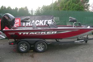 Tracker Pro Team 195 Tournament Edition 2025 Tracker Pro Team 195 Tournament Edition boat on trailer, red with black accents.