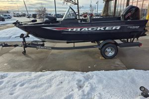 Tracker Pro Guide V-175 Combo 2026 Tracker Pro Guide V-175 Combo boat on trailer, parked on snowy pavement.
