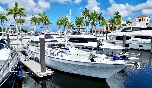 Lancer Yachts Motorsailer 1983 Lancer Yachts Motorsailer docked in a sunny marina with palm trees.