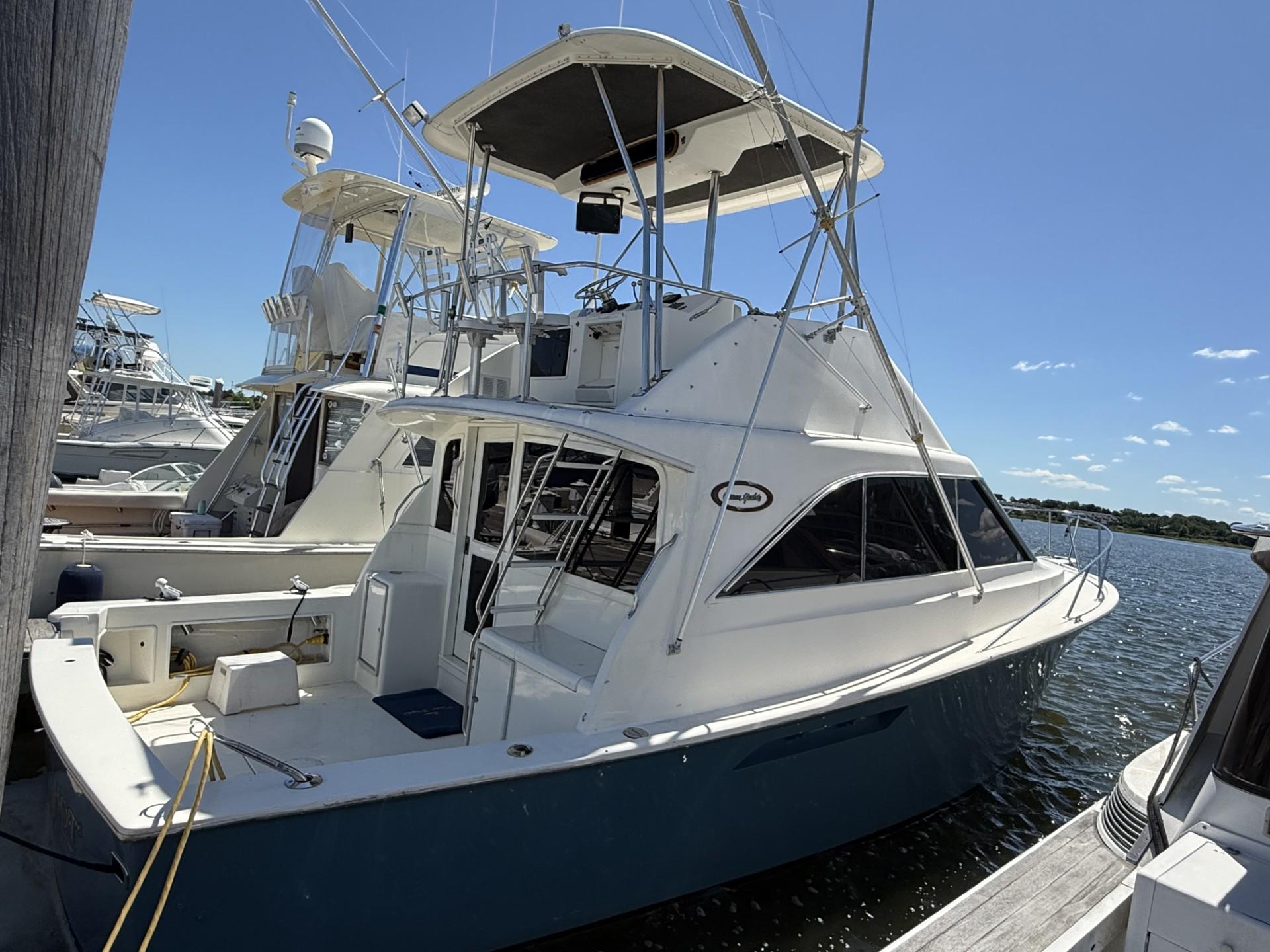 Ocean Yachts 35 Flybridge 1988 Ocean Yachts 35 Flybridge docked, showcasing sleek design and spacious deck.