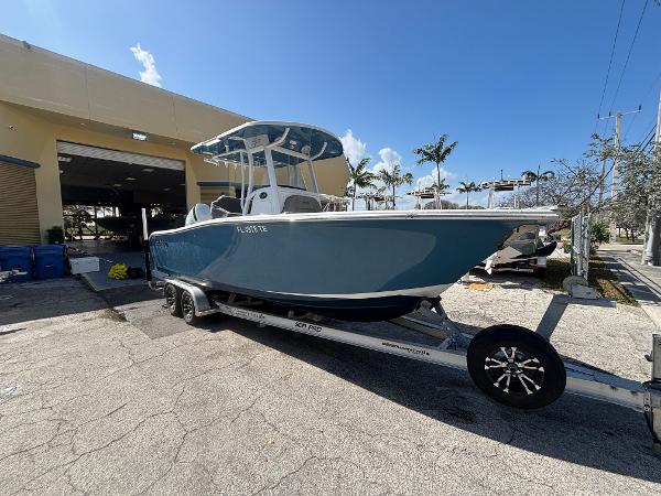 Sea Pro 239 Center Console 2022 Sea Pro 239 Center Console boat on trailer, parked outdoors.