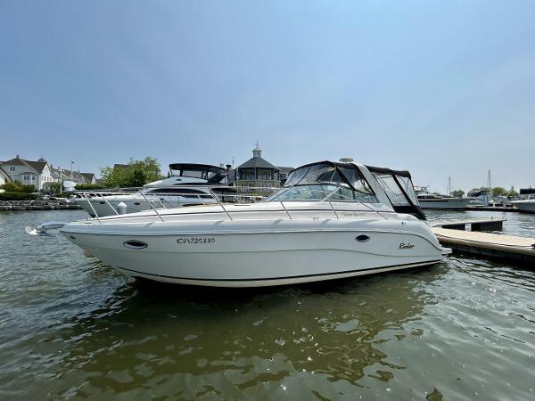 Rinker 310 Fiesta Vee 2003 Rinker 310 Fiesta Vee boat docked at marina under clear sky.