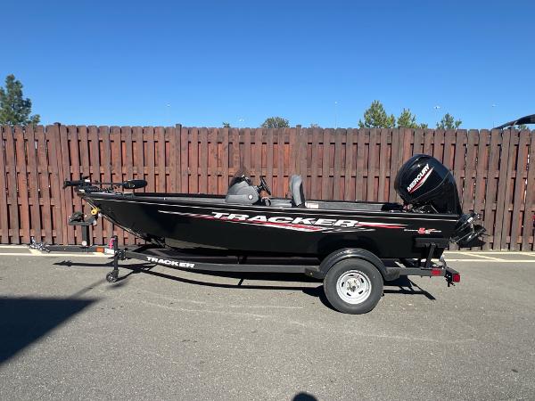 Tracker Super Guide V-16 SC 2025 Tracker Super Guide V-16 SC boat on trailer, parked outdoors.