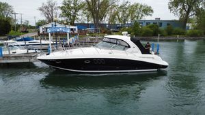 Sea Ray 38 Sundancer 2008 Sea Ray 38 Sundancer yacht docked at marina, calm waters, overcast sky.
