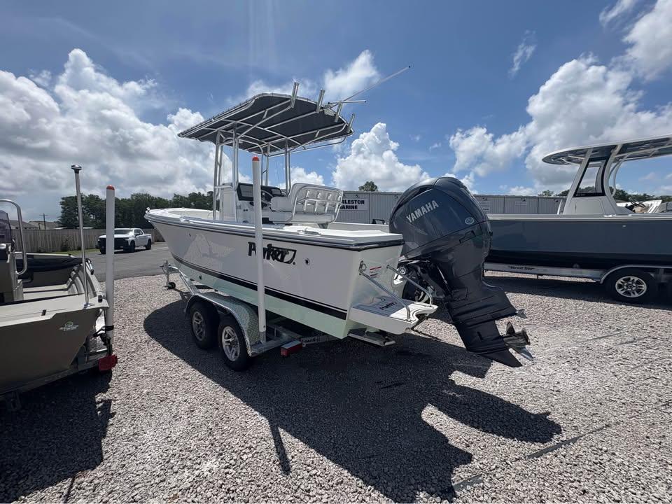 Parker 210 COASTAL 2026 Parker 210 COASTAL boat with Yamaha engine on trailer, parked outdoors.