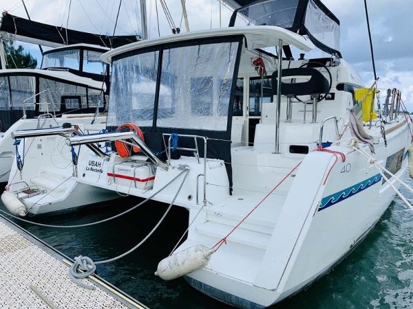Lagoon 40 2018 Lagoon 40 catamaran docked, featuring spacious deck and modern design.