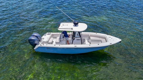 Sea Hunt Gamefish 27 Forward Seating 2023 Sea Hunt Gamefish 27 boat on clear water, showcasing forward seating design.