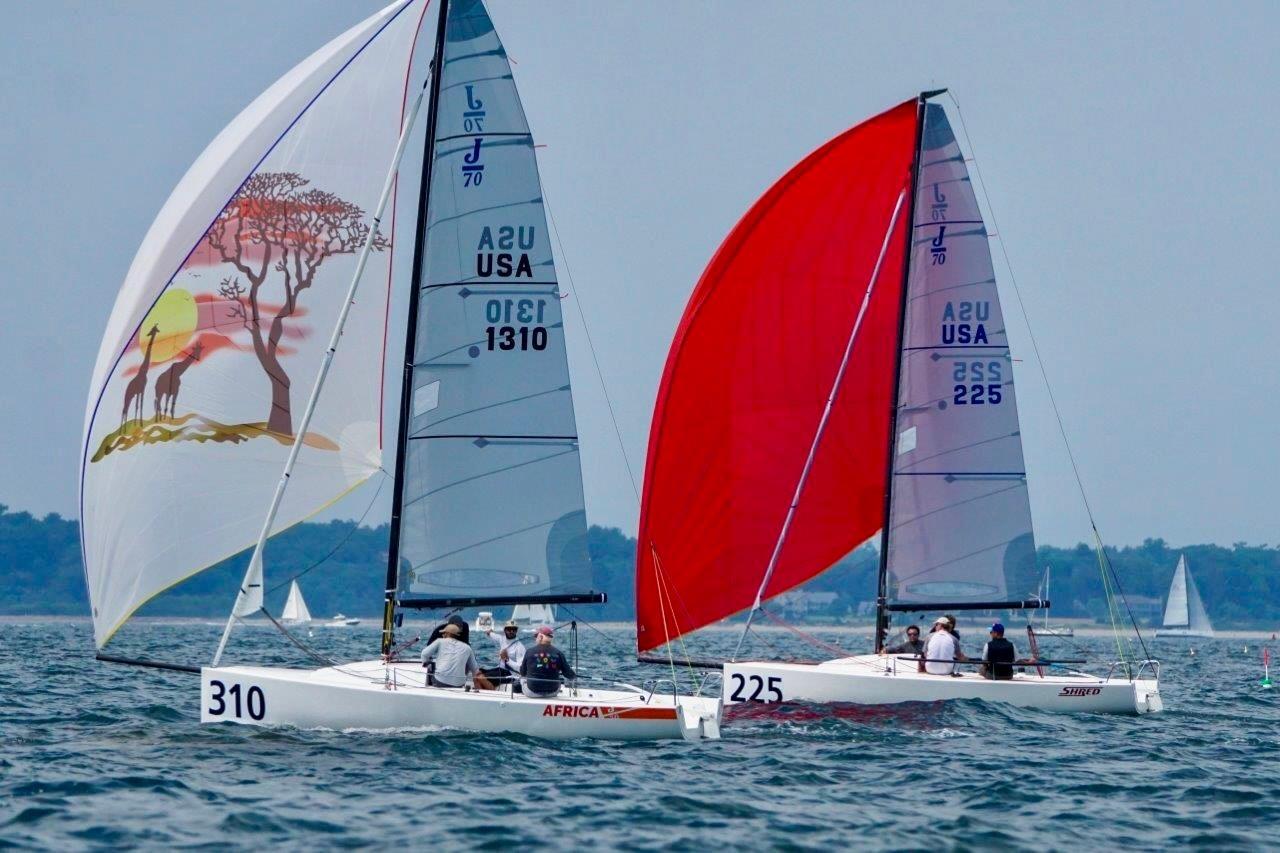 J Boats J/70 Sailboats J Boats J 70 racing on water, vibrant spinnakers, 2013 model.