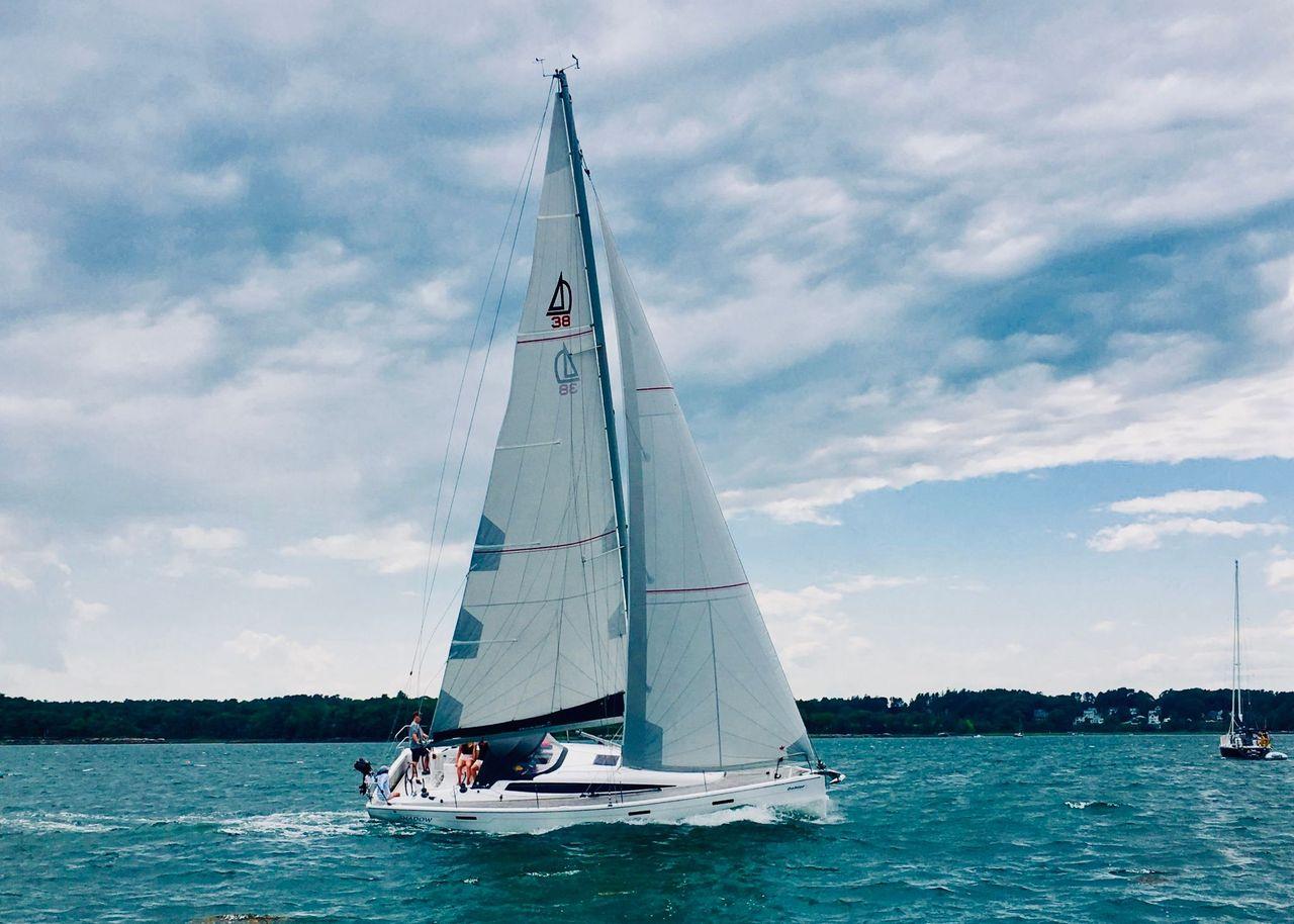 Dehler 38 2014 Dehler 38 sailboat cruising on a scenic, cloudy day.
