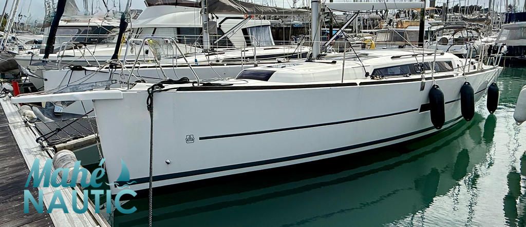 Dufour DUFOUR 360 2019 Dufour 360 sailboat docked in marina, sleek white design, calm water reflection.