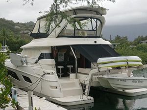Aquila 44 Luxury 2016 Aquila 44 yacht docked in a scenic marina setting.