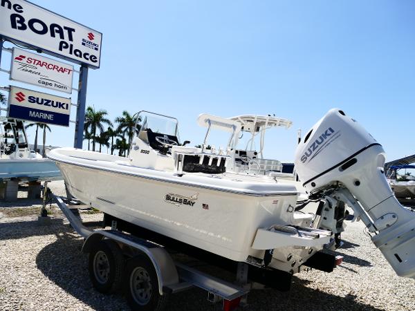 Bulls Bay 2000 2025 Bulls Bay 2000 boat with Suzuki engine on trailer at dealership.