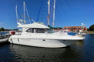 Jeanneau Prestige 36 2004 Jeanneau Prestige 36 yacht docked in a marina under clear blue skies.