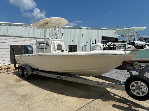 Pathfinder 2500 Hybrid 2021 Pathfinder 2500 Hybrid boat on a trailer in a marina.