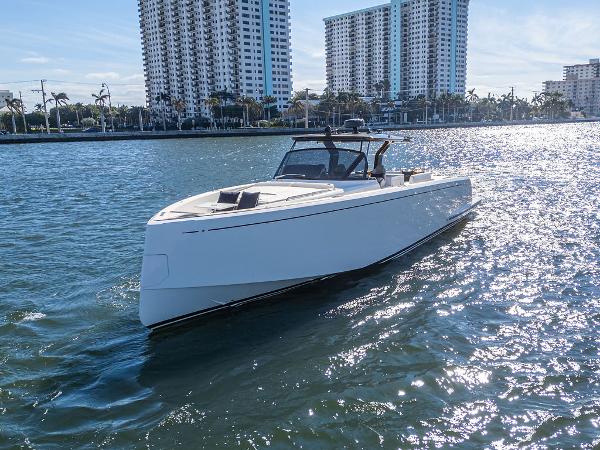 Pardo Yachts 50 2019 Pardo Yachts 50 cruising on sunny waterfront with city skyline.